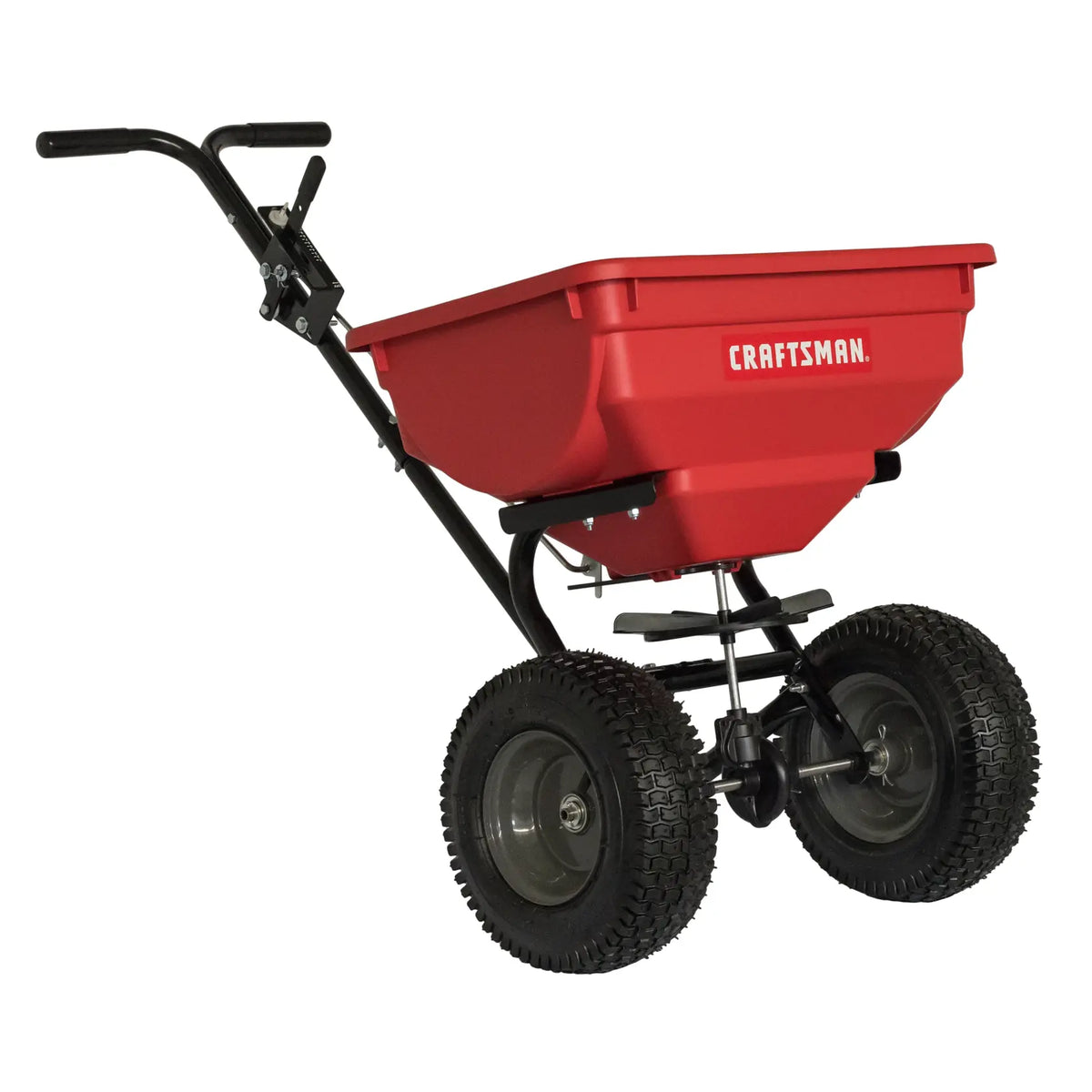 Photo of Craftsman CMXGZBF450532 red push broadcast spreader with black handle and two large wheels, side angle.