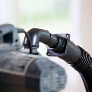 Close-up photo of Craftsman wet/dry vacuum hose connector attached to vacuum unit, SKU CMXZVBE38677.