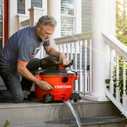 Photo of Craftsman wet/dry vacuum CMXZVBE38779 draining water on porch.